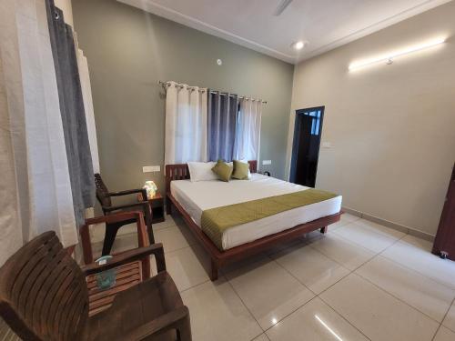 a bedroom with a bed and a chair in it at 11 Gaon Homestay Lansdowne in Lansdowne