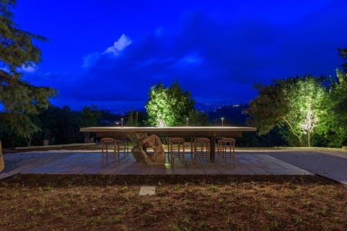 a picnic table in a park at night at Amani Luxury 4-Bedroom Villa & Pool in Batroun in Batroûn