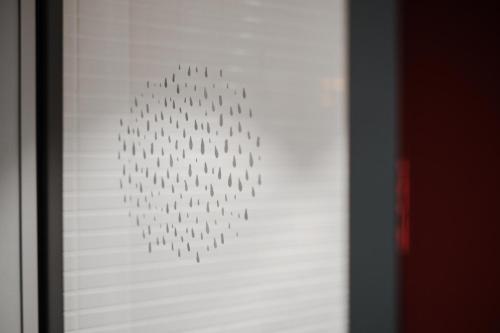 a picture of a group of figures on a wall at Hobo Hotel Stockholm in Stockholm