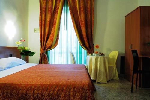 Ένα ή περισσότερα κρεβάτια σε δωμάτιο στο Hotel Villa Giusy