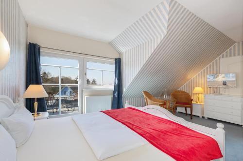 Tempat tidur dalam kamar di Hotel Klaus Störtebeker