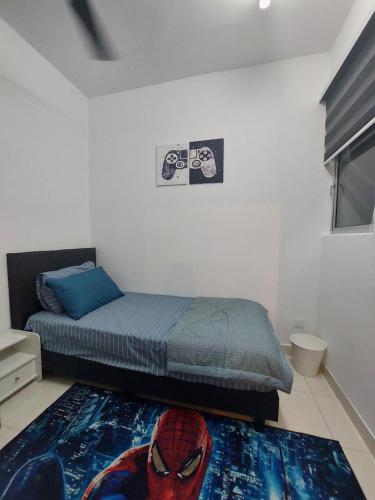 a bedroom with a spider man bed and a rug at KLIA Travel Homestay - 3R 2B - WIFI & NETFLIX in Sepang