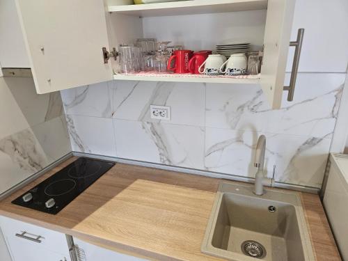 Cuisine ou kitchenette dans l'établissement Rooms Vlaovic
