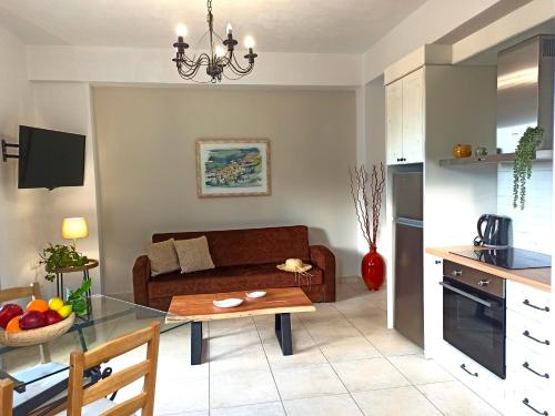 a living room with a couch and a table at Endless Green 4 Arethousa Ikaria in Arethousa