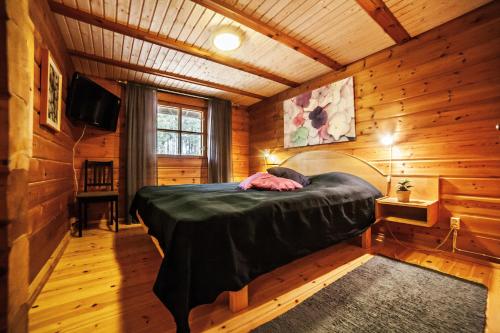 Ліжко або ліжка в номері Villa Skitunäs
