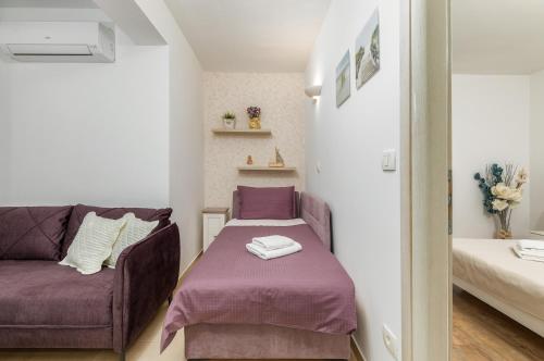 Postel nebo postele na pokoji v ubytování Apartman Gardenia