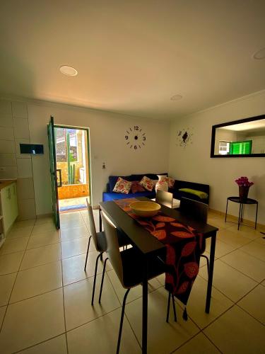a living room with a table and a couch at ApKanariooo in Frontera