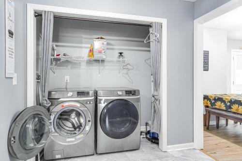 a laundry room with a washer and dryer at Above-Ground Pool and Backyard at Murfreesboro Home! in Murfreesboro