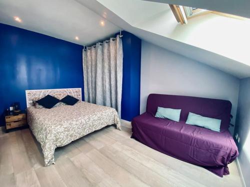 Ένα ή περισσότερα κρεβάτια σε δωμάτιο στο Charmant Duplex en centre-ville