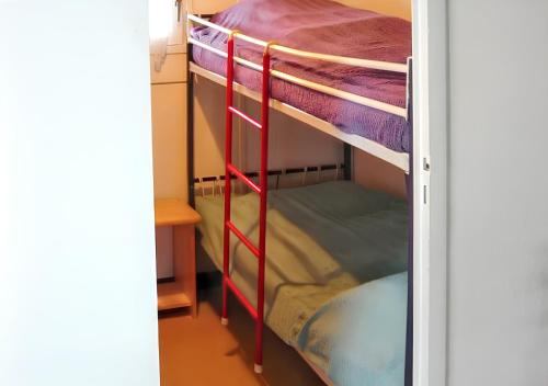 a bunk bed room with two bunk beds at Chalet de 2 chambres avec jardin amenage a Metabief in Métabief