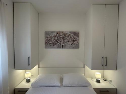 Postel nebo postele na pokoji v ubytování Apartments Angelo