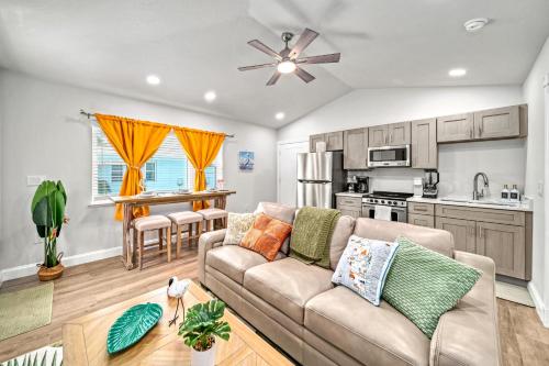 a living room with a couch and a kitchen at Bird of Paradise - 544A in Sarasota