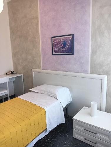 Ένα ή περισσότερα κρεβάτια σε δωμάτιο στο Albergo Belvedere