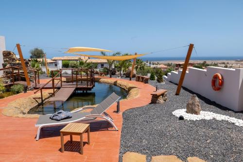 a pool on the roof of a house at Finca Roberto by Don Robertos Finca Paraíso in Parque Holandes