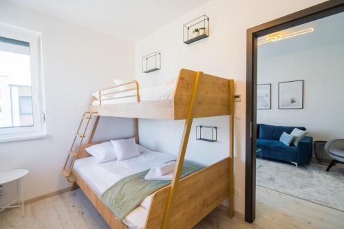 Postel nebo postele na pokoji v ubytování Blue Dream Apartman
