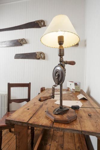a lamp sitting on top of a wooden table at Hotel Boutique La Yegua Loca in Punta Arenas