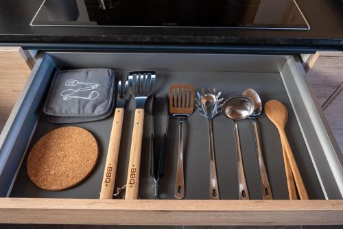 a drawer filled with utensils in a kitchen at Finca Roberto by Don Robertos Finca Paraíso in Parque Holandes