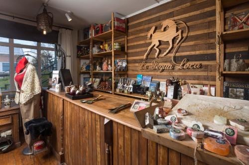 a store with a horse sign on the wall at Hotel Boutique La Yegua Loca in Punta Arenas