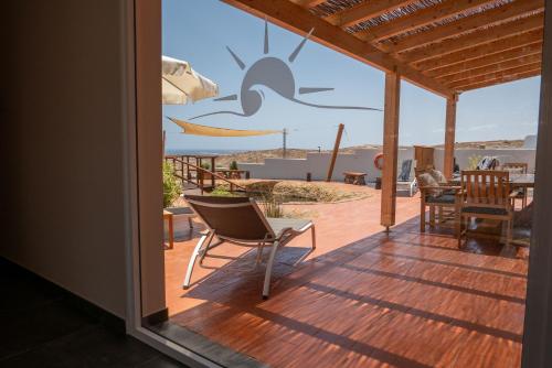 a house with a deck with a view of the ocean at Finca Roberto by Don Robertos Finca Paraíso in Parque Holandes