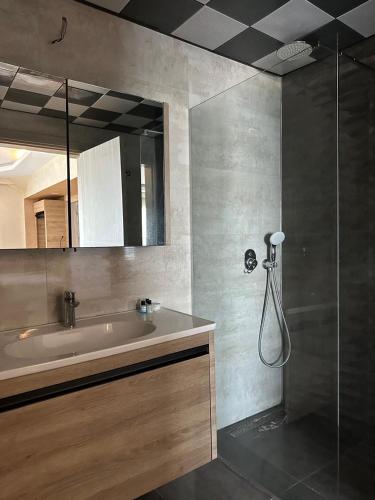 a bathroom with a sink and a shower at point beach hotel in Marmaris
