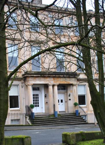 a large building with stairs in front of it at Dreamhouse Apartments Glasgow West End in Glasgow