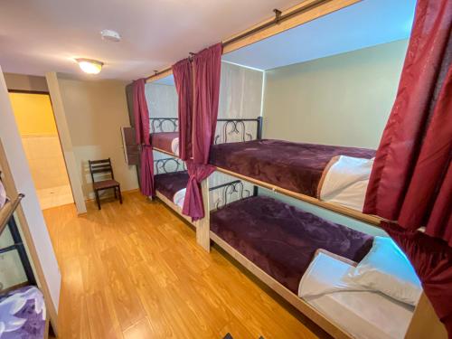 Postel nebo postele na pokoji v ubytování Golden Rest Latacunga