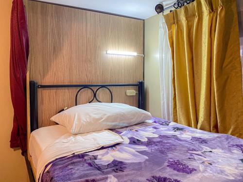 Ένα ή περισσότερα κρεβάτια σε δωμάτιο στο Golden Rest Latacunga