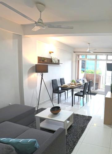 a living room with a couch and a table at Urban Stays by Empress in Hulhumale