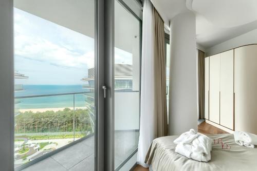 En eller flere senge i et værelse på Your Holidays Waves D1081