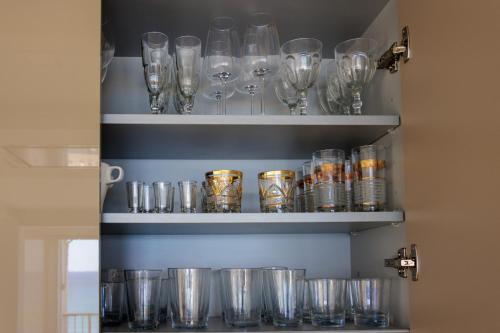 a bunch of glasses on shelves in a room at Texas in Alicante