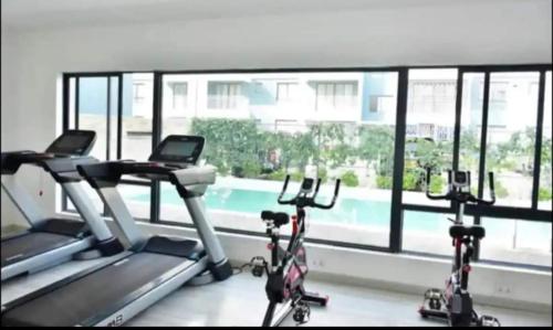 a gym with two exercise bikes in front of a window at POLAR HOMES in Syokimau
