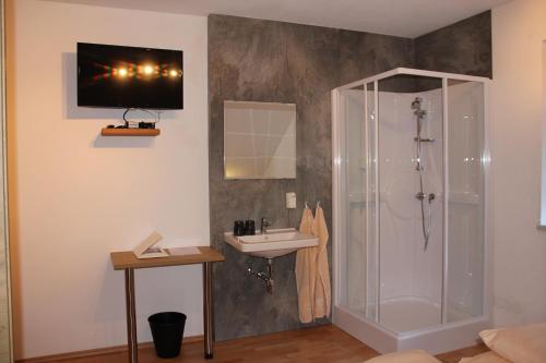 a bathroom with a shower and a sink at Chalet Mühle in Längenfeld