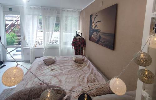 a bedroom with a bed in a room with a window at Ortopla Terrace Apartment Stinica in Stinica
