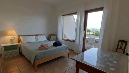 Postel nebo postele na pokoji v ubytování Casa Erika 38 in Is Molas Golf Resort