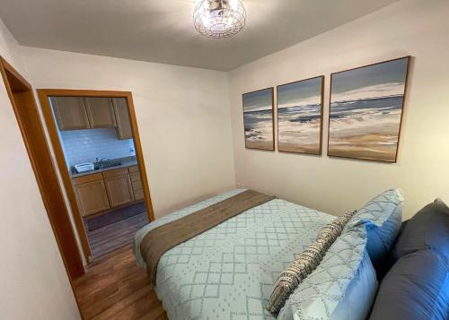 a bedroom with a bed and a couch at The Edenwild Boutique Inn in Lopez
