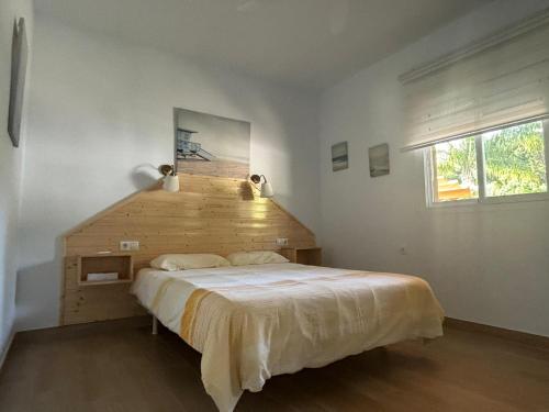 A bed or beds in a room at Villa El Hogar