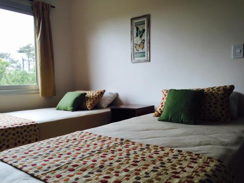 Un pat sau paturi într-o cameră la Las Brisas