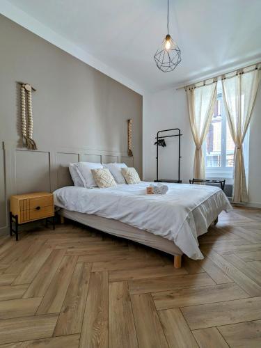 Ένα ή περισσότερα κρεβάτια σε δωμάτιο στο My'Home, centre-ville ancien