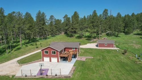 an aerial view of a red barn with a picnic table at Custer Connection in Nihart