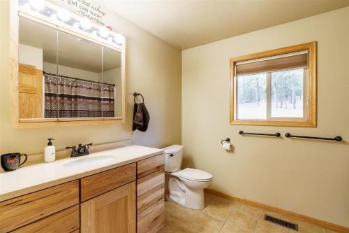 a bathroom with a sink and a toilet at Custer Connection in Nihart