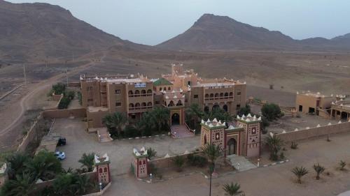 an aerial view of a building in the desert at La Perle Du Drâa in Zagora