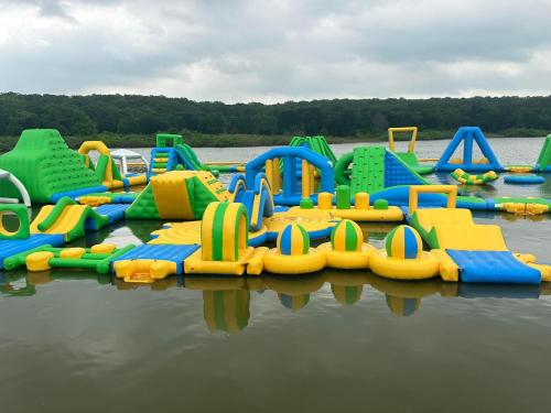 a group of inflatable play equipment in the water at Lakefront Cedar Cabin - 8 in Mead