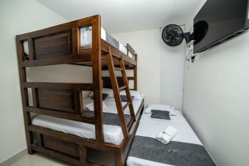 Postel nebo postele na pokoji v ubytování Apartahotel a 3km del parque del café