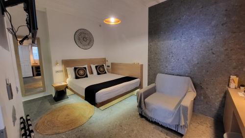 Postel nebo postele na pokoji v ubytování Mykonos Double Luxury Mini Suites-With External Hot spa Adults only