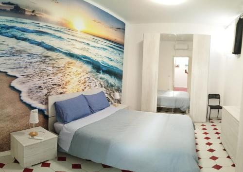 Postel nebo postele na pokoji v ubytování Nuovo bilocale a 100 mt dal mare