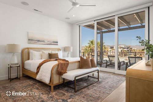 a bedroom with a bed and a balcony at Laguna Matata at Desert Color (by Ember Stays) in St. George