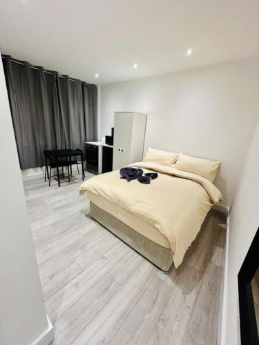 Postel nebo postele na pokoji v ubytování Studio Near London Big Ben