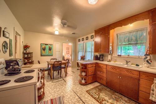 a kitchen with a table and a dining room at Das Mueller Haus in Fredericksburg