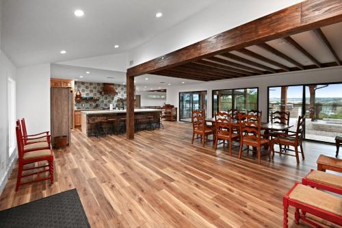 a kitchen and dining room with a table and chairs at Guadalupe Bluff Mediterranean in Kerrville