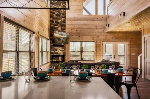 a dining room with a table and some chairs at Private Indoor Pool Cabin w/ Game Room & Hot Tub! in Pigeon Forge